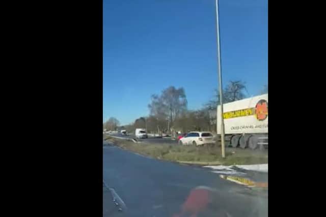 Footage shows a white Mercedes estate car driving the wrong way down the A4500 towards oncoming traffic, including a lorry.