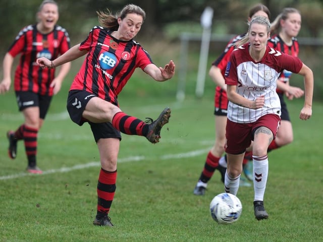 Eleanor Rose of Dronfield Town clears the ball