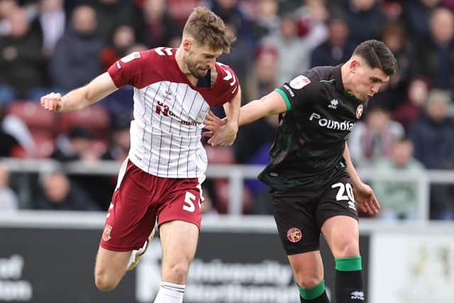 Jon Guthrie tussles with Walsall striker Matt Stevens
