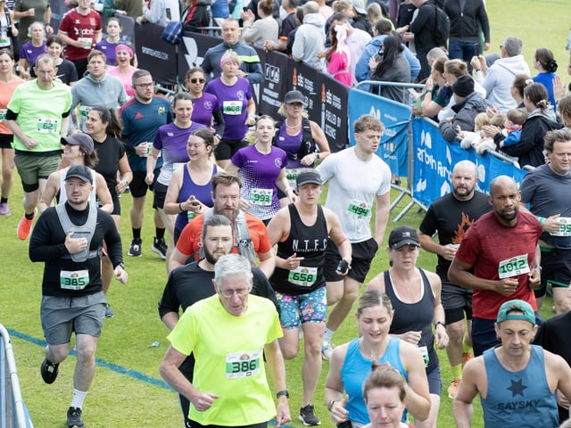 Hundreds of runners braved showers and wind to take on the race on Sunday (May 25), which started and finished at Sixfields stadium.
