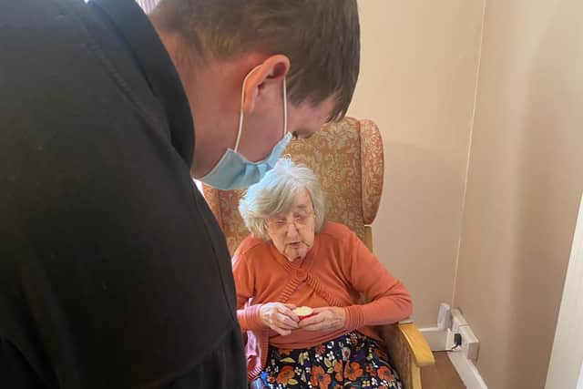 Students visited care home residents, served them tea and cake and sang with them.