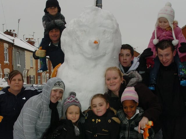 Residents show off a snow man they have been building since 4am. Thursday, 5th February 2009