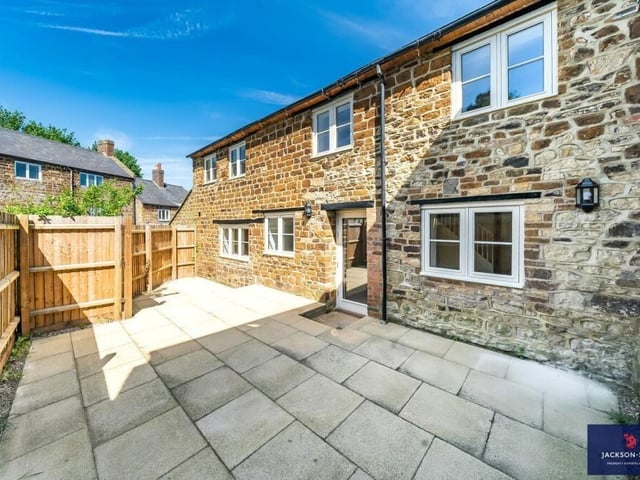 The back garden of the property is paved over