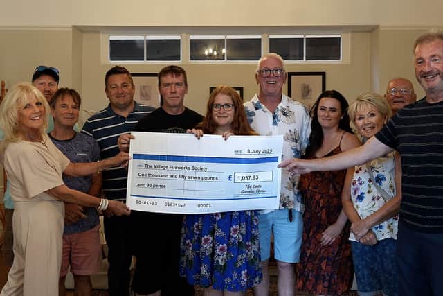 The Village Fireworks Society cheque presentation.