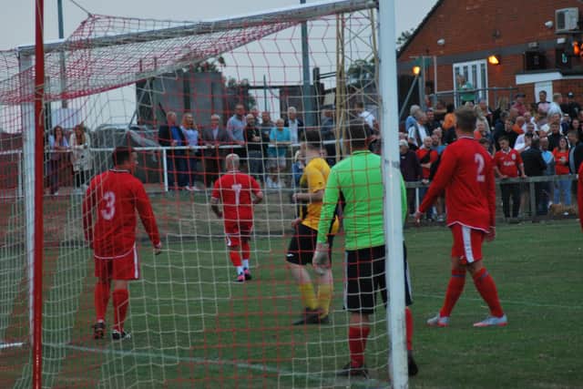 Charity football match in action