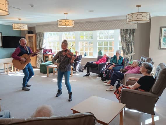 Residents watched on as the energetic duo played and danced