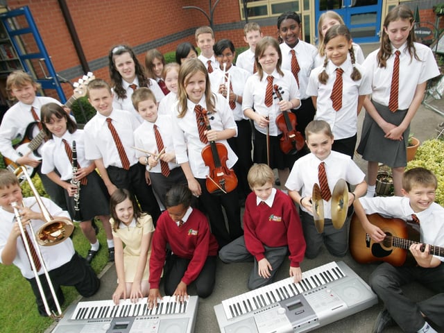 Woodland View Primary School music group with headteacher Mark Thomas and deputy headteacher Bev Affleck