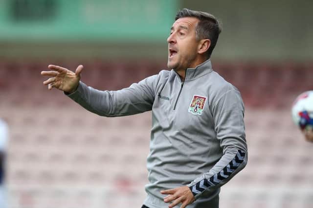 Cobblers manager Jon Brady issues instructions during the 3-0 defeat to West Bromwich Albion on Wednesday night