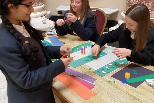 Students from Caroline Chislom School spend time in the Marble Saloon getting creative.