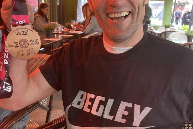 Tony Begley Celebrating completing The London Marathon in aid of The Lowdown.