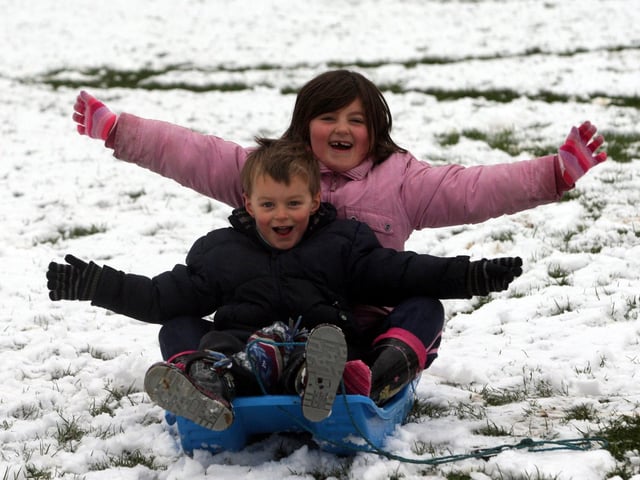Easter Sunday snow in and around Northampton in 2008. Eve Gordon aged 7 and little brother Joe Gordon aged 4 sledging at Abington Park