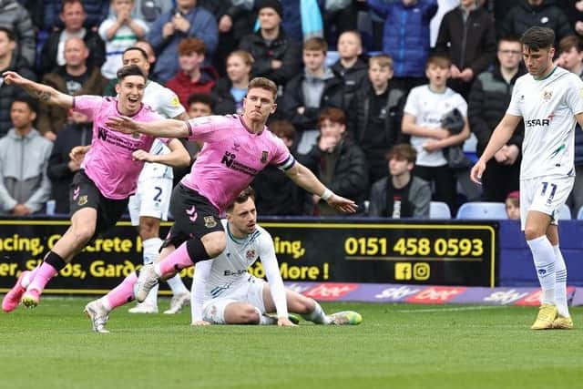 Sam Hoskins celebrates his promotion-winning goal against Tranmere. Picture: Pete Norton