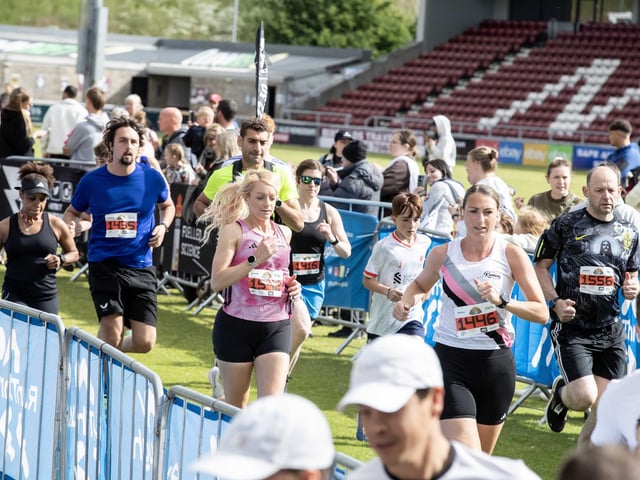 Hundreds of runners braved showers and wind to take on the race on Sunday (May 25), which started and finished at Sixfields stadium.