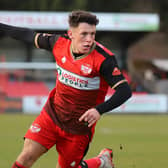 Frankie Maguire heads off to celebrate after he scored the only goal of the game to give Kettering Town a 1-0 win over Brackley Town. Pictures by Peter Short