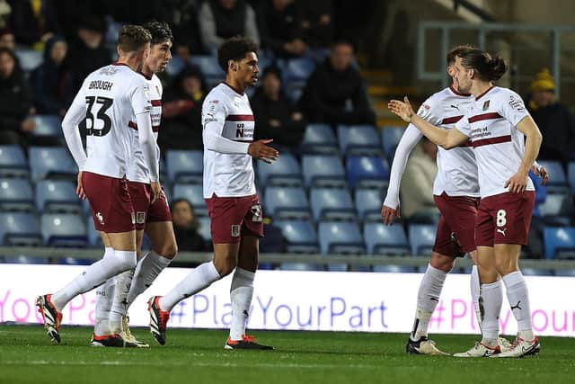 Will Hondermarck celebrates with his team-mates after scoring the first of the Cobblers' two goals at Oxford United (Picture: Pete Norton)