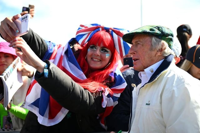 Racing legend Sir Jackie Stewart poses for a selfie