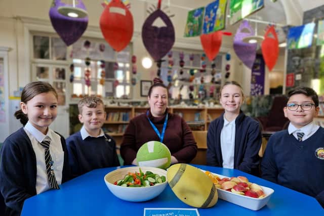 Teacher Abbi Smith and Year 6 pupils at Stimpson Avenue Academy, which has been awarded a Healthy School Award.