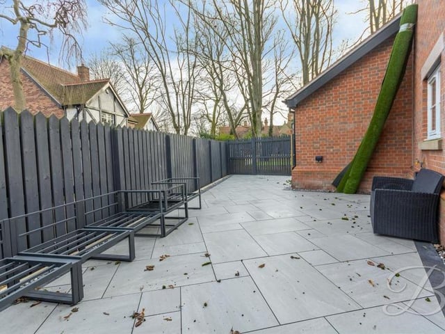 A closer look at the patio area. A surrounding fence guarantees privacy.