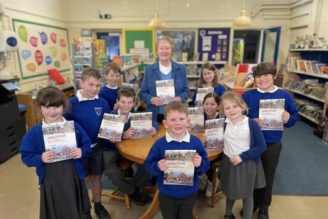 Author Enid Jarvis with children from Spratton CE Primary School