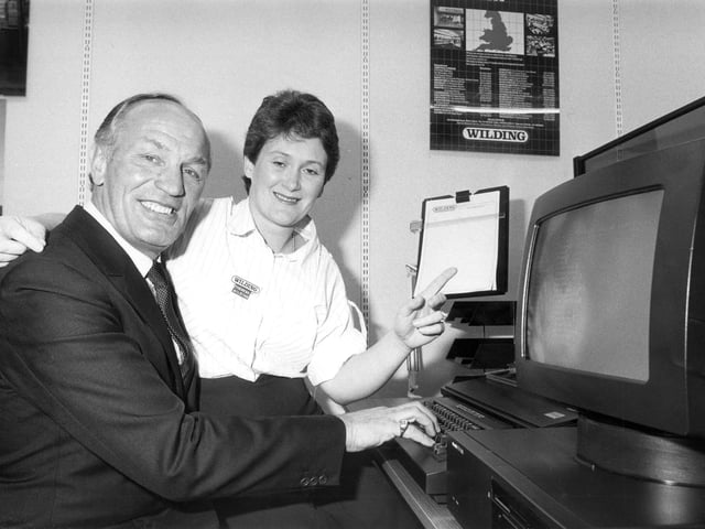 Ex-boxer Henry Cooper with Teresa Wilding of Wildig Office Equipment, Gold Street, Northampton Nov 1985
