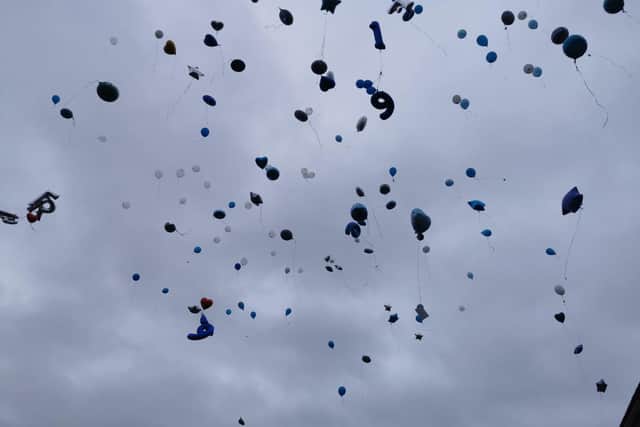 Balloons were released in memory of Fred