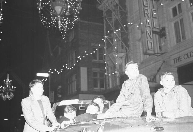 Christmas decorations in Gold Street, Northampton youths in a Triumph Herald 12/50 Convertible