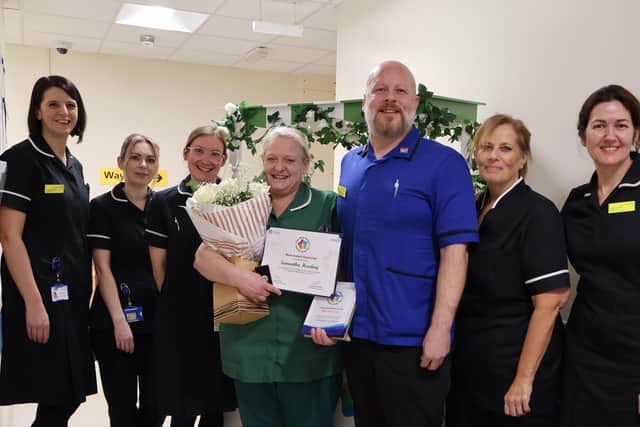 Samantha with award and some of the senior nursing team.