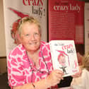 Glennis Hooper with her book 'She's One Crazy Lady'