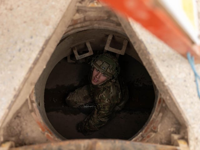 Lance Corporal Rowan from 2nd Battalion The Royal Anglian Regiment looks up as he passes through the tunnel system of the Confidence Course in Copehill Down.The course was part of the regiment's build up training ahead of their deployment onto Exercise Wessex Storm.