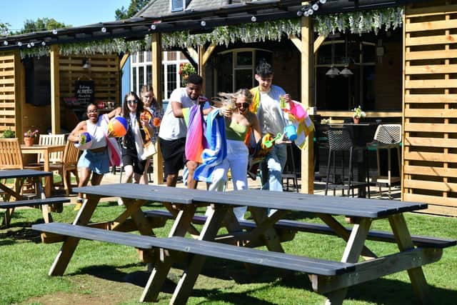 The Spinney Hill pub allows customers to reserve seats in its beer garden - using a beach towel.