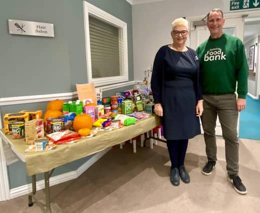 Matthew and General Manager Joanna Mosses with the items kindly donated for the Food Bank