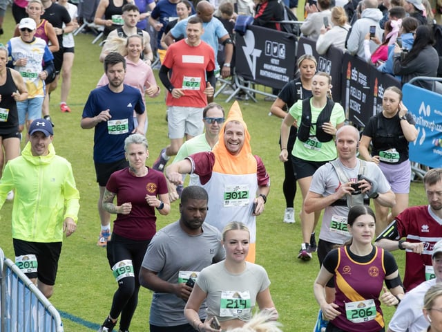 Hundreds of runners braved showers and wind to take on the race on Sunday (May 25), which started and finished at Sixfields stadium.