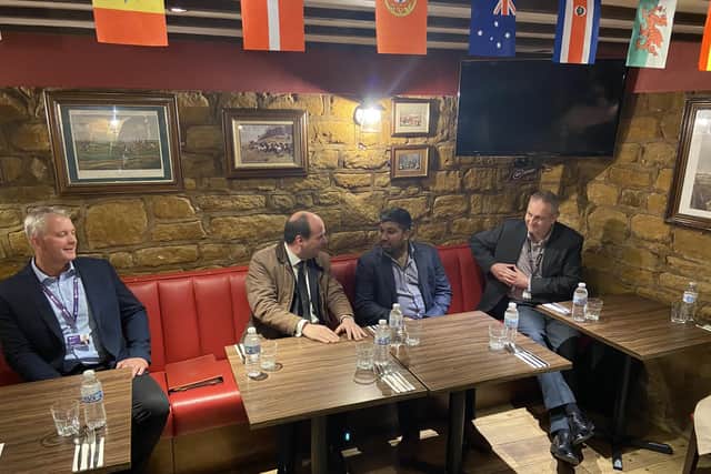 Pictured: Transport Minister Richard Holden with the owner of The Red Lion Truck Stop, discussing the facilities they have on offer.