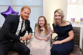 Margot Jones-Billington with mum, Laura, and Prince Harry, at the WellChild awards. Picture: Antony Thompson/Thousand Word Media Ltd