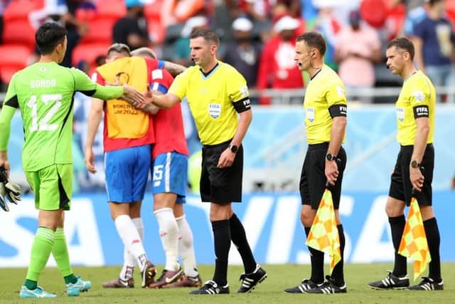 Stuart Burt (second from right) has ran the line at two matches so far in the 2022 FIFA World Cup, including Costa Rica's group win over Japan