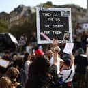 Supporters of the XL Bully dog breed hold placards during a protest against the UK Government's plans for the breed.