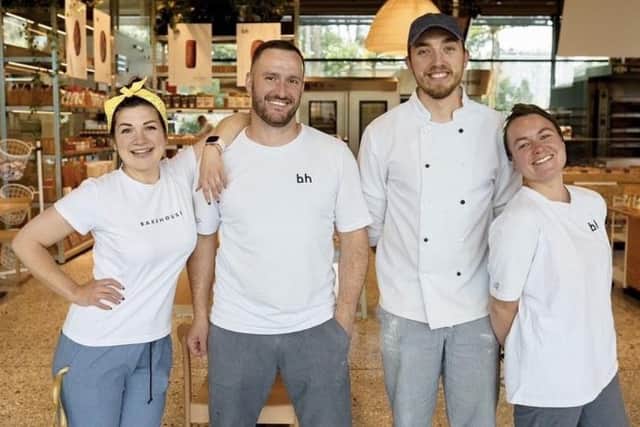 Anna Makievska is the inspiration behind the book as even after her bakery was bombed, her team (pictured) have continued to bake from the basement and have donated over 100,000 loaves to those in need.