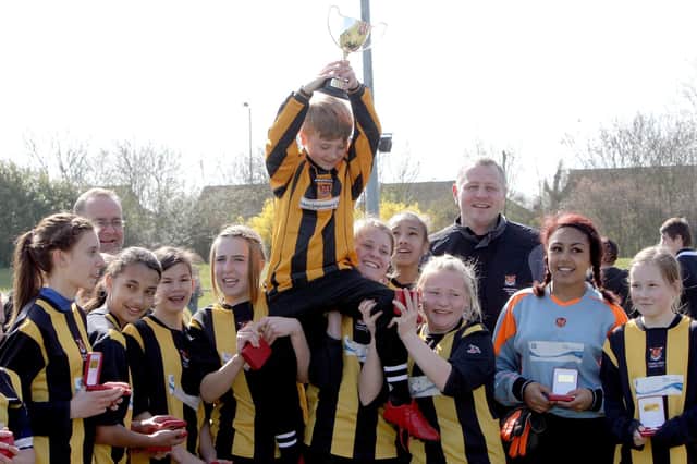 Parkland Tigers celebrate winning the Raunds NFA U14 girls Invitation Cup in 2012.