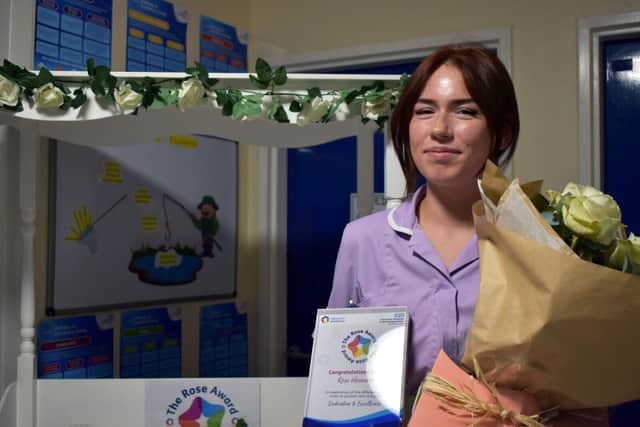 Naeve Hadler receives her ROSE award