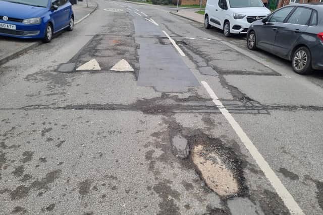 The half-mile stretch of Grange Road in Eastfield is full of large potholes