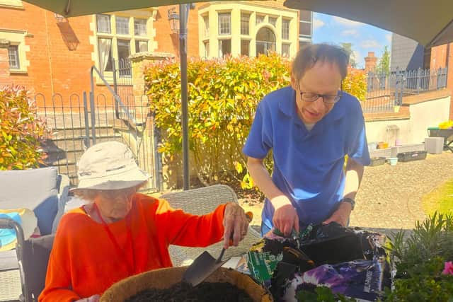 Residents enjoy the sun and get planting at Elm Bank Care Home in Kettering.