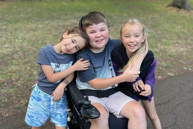 11-year-old Xavier Cadden, with his sisters Phoebe, seven, and Eva, nine.