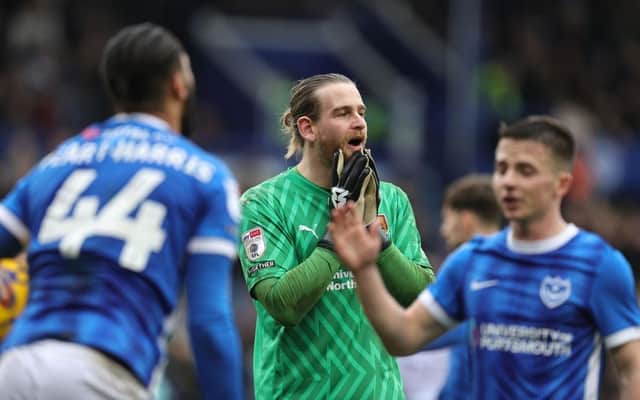 Lee Burge cannot believe the decision to award Portsmouth a penalty, but Town's goalkeeper kept out Colby Bishop's spot-kick.
