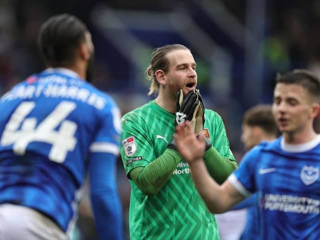Lee Burge cannot believe the decision to award Portsmouth a penalty, but Town's goalkeeper kept out Colby Bishop's spot-kick.