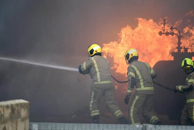 The new recruits tackling a fire during thier Passing out parade