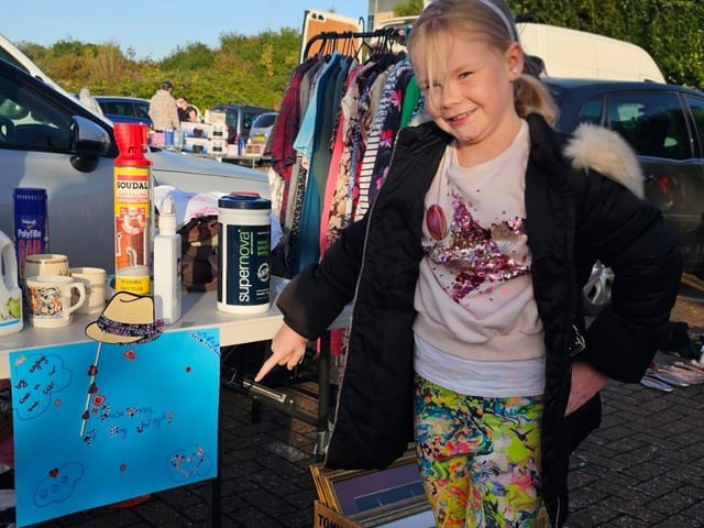 Ava selling items at Car Boot