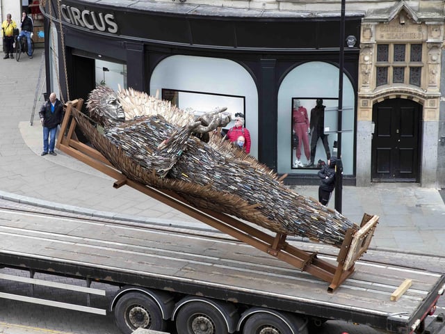 A huge crane hoisted the Knife Angel off the lorry and into position outside All Saints' Church