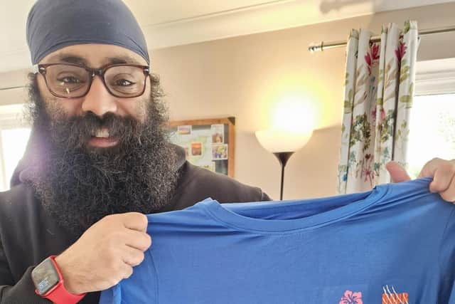 Arun Shergill from RAUR showing off the burlesque squads branded t-shirts.