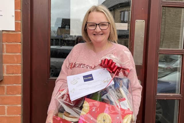 Leanne Ward handing out Christmas hampers