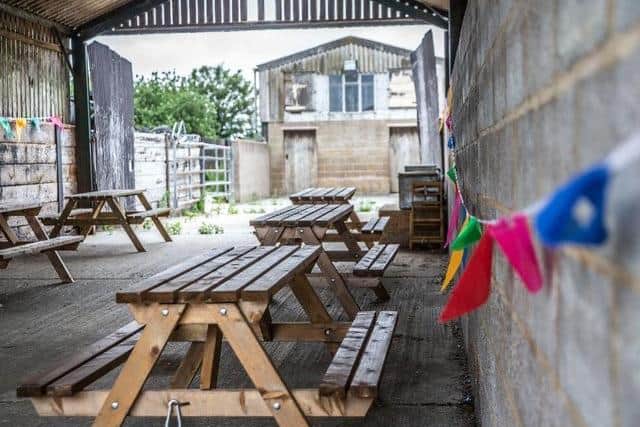 Elliotts' Rectory Farm's events space in an old barn, which also provides seating for the Brew caravan cafe. Photo: Kirsty Edmonds.